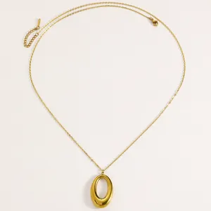 Detail view of high-quality minimalist gold titanium steel oval pendant necklace