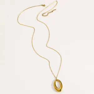 Detailed view of a minimalist gold-plated titanium steel necklace with an oval pendant.