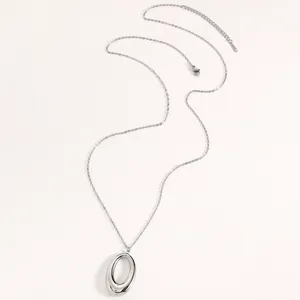 Detailed view of a minimalist silver U-shaped pendant on a titanium steel chain.