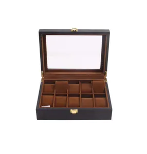 Interior detail of 10-slot black lacquered wooden watch box with brown suede pillows