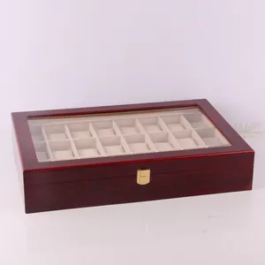 Detailed view of a 20-slot lacquered wooden watch storage box with glass lid and gold clasp