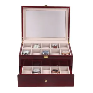 Detail view of the high-gloss red wooden watch box with dual-tier storage drawer.