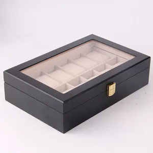 Detail view of 10-slot black lacquered wooden watch storage box with glass lid top