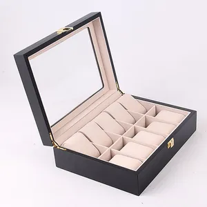 Detail of 10-slot wooden watch box with black lacquer finish and soft beige lining.