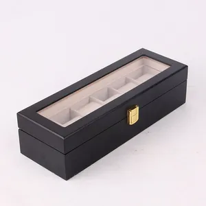 Detailed view of black wooden watch storage box with lacquer finish and 6 slots