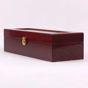 Glossy dark red wooden watch box display case with golden metal latch and glass top lid