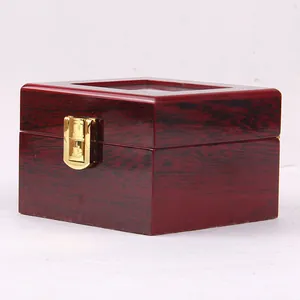 Elegant dark red wooden watch box with high-gloss lacquer and gold clasp