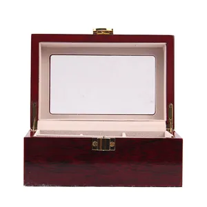 Close-up detail showing the open interior and plush lining of a lacquered wooden watch box