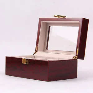 Detailed view of an open wooden watch storage box with glossy lacquer finish and velvet lining