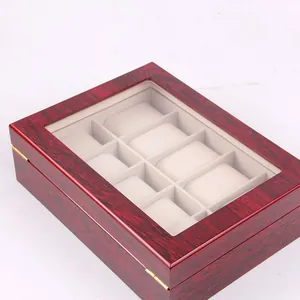 Detailed macro view of a 10-slot wooden watch storage box with premium red lacquer finish