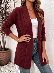 Detailed view of women's burgundy knit cardigan featuring decorative buttons and mid-length style.