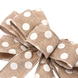 Rustic burlap Christmas bow with white polka dots for tree and wreath decoration