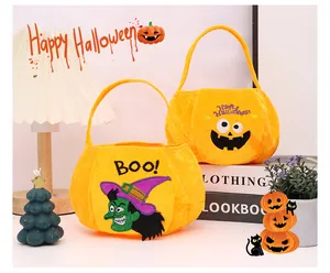 Detailed view of plush Halloween candy bags with festive witch and pumpkin designs