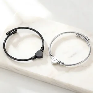 Macro view of 304 stainless steel cable bracelet featuring engraved heart charms
