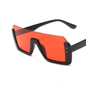 Oversized square frame sunglasses with integrated red shield lenses and black frames