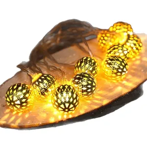 Warm white Moroccan hollow metal ball LED string lights for festive Christmas room decor