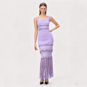 Elegant lavender bandage evening dress with shimmering sequin fringe and a slim fit silhouette.