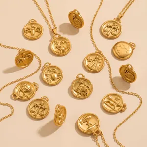 Gold-plated stainless steel zodiac coin pendants with embossed constellation symbols