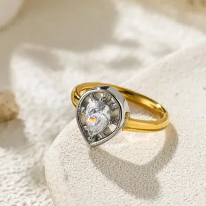 Detailed macro view of pear-cut zircon stone set in a luxury water drop shaped gold ring