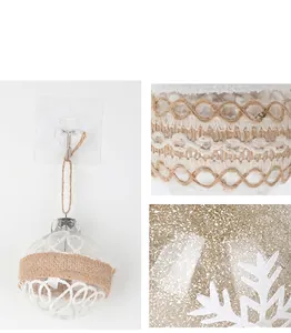 Macro detail of transparent Christmas ball ornament with jute rope and snowflake