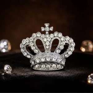 Exquisite silver crown brooch featuring sparkling clear rhinestones for elegant apparel