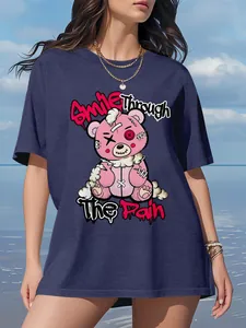 Detailed view of navy blue loose T-shirt featuring a creepy cute pink bear graphic