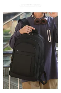 Detailed lifestyle shot of a professional black large-capacity business laptop backpack