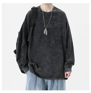 Detail view of washed black oversized long-sleeved t-shirt with high-street vintage style