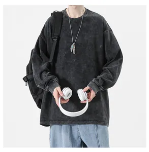 Distressed washed long-sleeve cotton T-shirt in oversized streetwear style with grey finish.