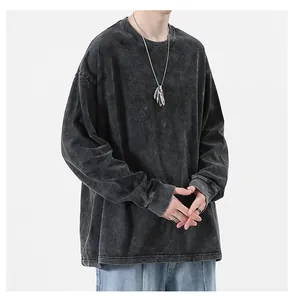 Close-up detail of a high street acid wash oversized long sleeve cotton T-shirt for men