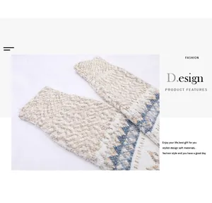 Close-up detail of snowflake pattern and soft knit texture on a winter sweater sleeve