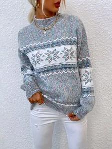 Detail shot showing the texture of this cozy mock neck Christmas sweater with snowflake pattern