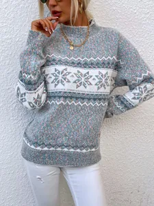 Close-up of women's Christmas knit sweater featuring blue snowflake pattern and soft texture