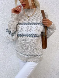 Detailed knit of women's Christmas snowflake sweater with mock neck and gold jewelry