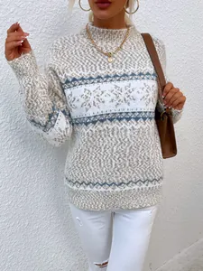 Close-up of Fair Isle snowflake pattern on a cozy half-high neck beige sweater.
