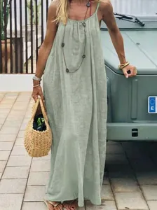 Close-up of sage green spaghetti strap maxi dress with a relaxed loose fit for summer.