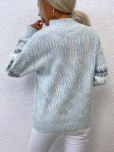 Detailed back view of a blue and white snowflake knit sweater featuring a stylish mock neck.