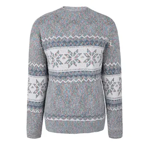 Close-up of women's knitted Christmas sweater featuring festive snowflake patterns