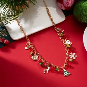 Collana natalizia con ciondoli Babbo Natale, renna e fiocco di neve in oro