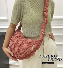 Close-up of a pink bubble quilted puffy cloud bag with soft pleated fabric texture