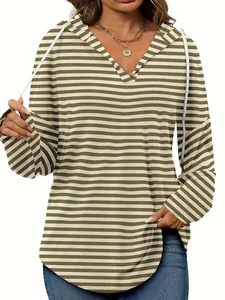 Detail shot of women's loose-fit striped hoodie featuring a V-neck and white drawstrings
