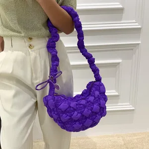 Close-up detail of a vibrant purple pleated bubble texture shoulder bag for women