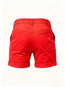 Detailed back view of vibrant red slim-fit denim shorts featuring a classic cuffed hem