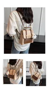 Gros plans d'un sac à dos vintage crème et marron porté en sac à bandoulière élégant