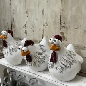 Detailed macro view of funny resin rooster figurines with big eyes for outdoor garden decor