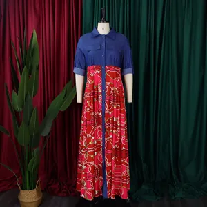 Detail of a denim patchwork maxi dress with red chain print on a studio mannequin