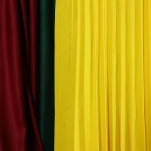 Close-up detail of multi-colored pleated fabric texture for elegant summer dress