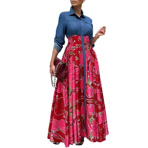 A detailed view showing the stylish denim patchwork and vibrant printed pleated maxi dress skirt