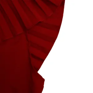 Macro view of the neat stitching and pleated ruffle texture on a wine red garment.