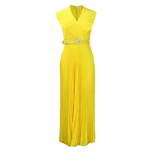 Close-up view of a yellow pleated maxi dress featuring a ruffle V-neck and belted waist.